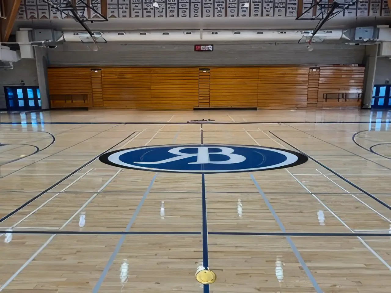 Gymnasium court with custom center-court school crest