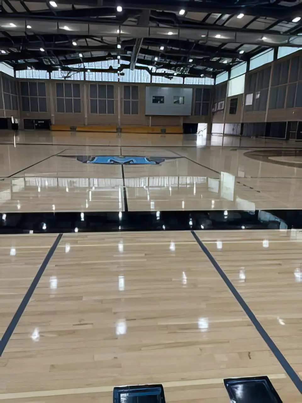 Freshly refinished gymnasium key with new three-point arc