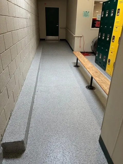 Locker room corridor with new resinous floor and access ramp